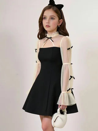 Spring and autumn fashion for girls: elegant, refined, vintage, Hepburn-style black dress.