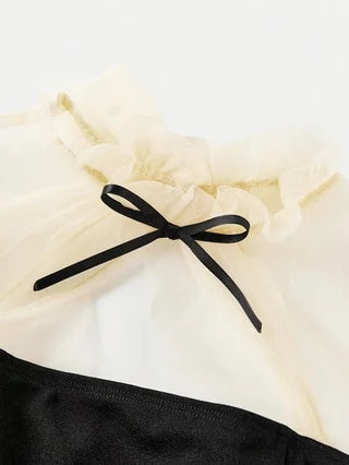 Spring and autumn fashion for girls: elegant, refined, vintage, Hepburn-style black dress.