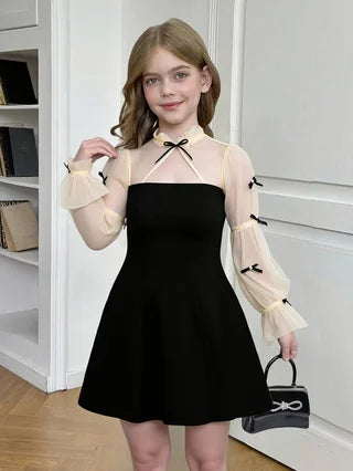 Spring and autumn fashion for girls: elegant, refined, vintage, Hepburn-style black dress.