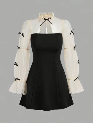 Spring and autumn fashion for girls: elegant, refined, vintage, Hepburn-style black dress.